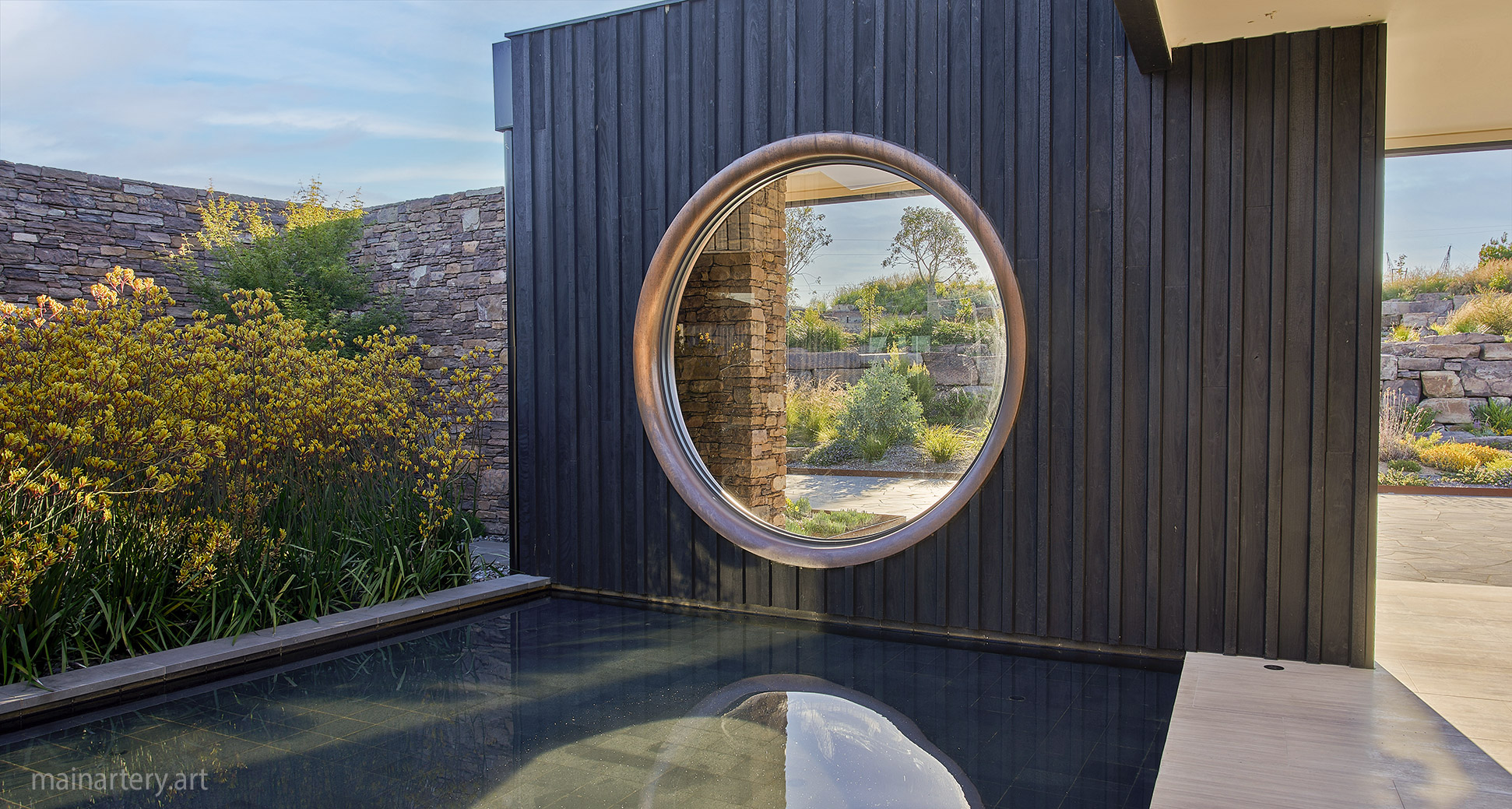 huge modern copper landscape sculptural window feature image