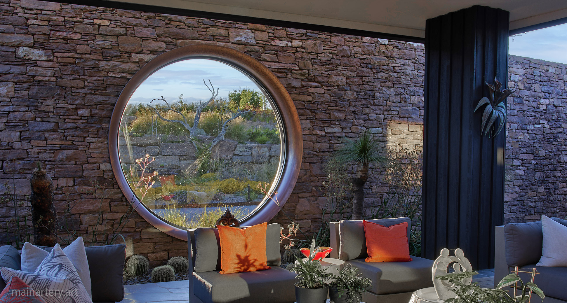 giant circular copper architectural window feature outdoor lounge image
