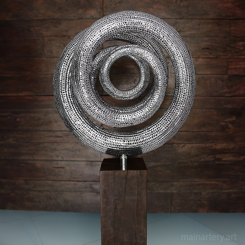 Cover: Loop Cycle Stainless Sculpture