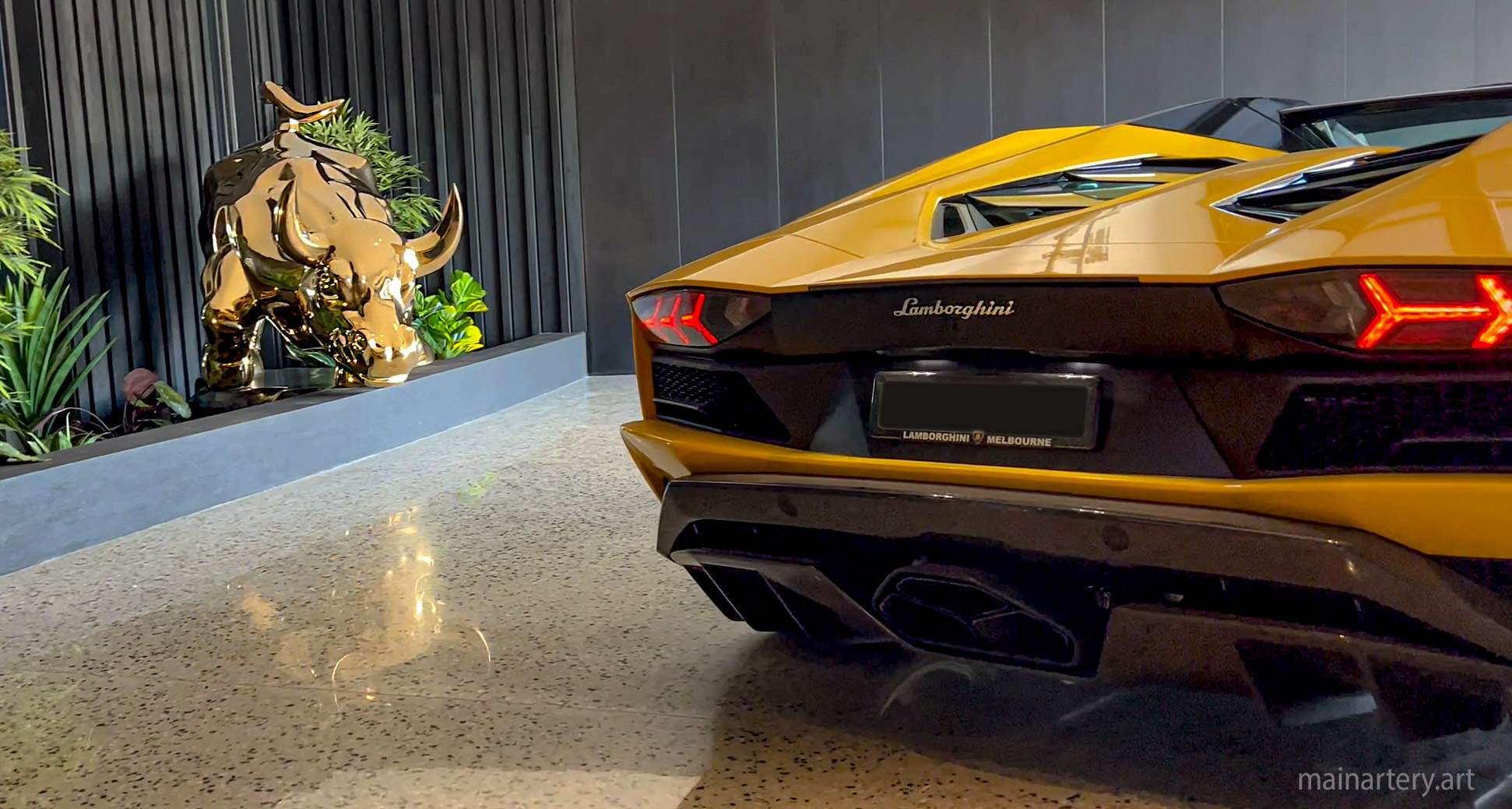 huge mirror polished wallstreet bull lamborghini landscape sculpture image