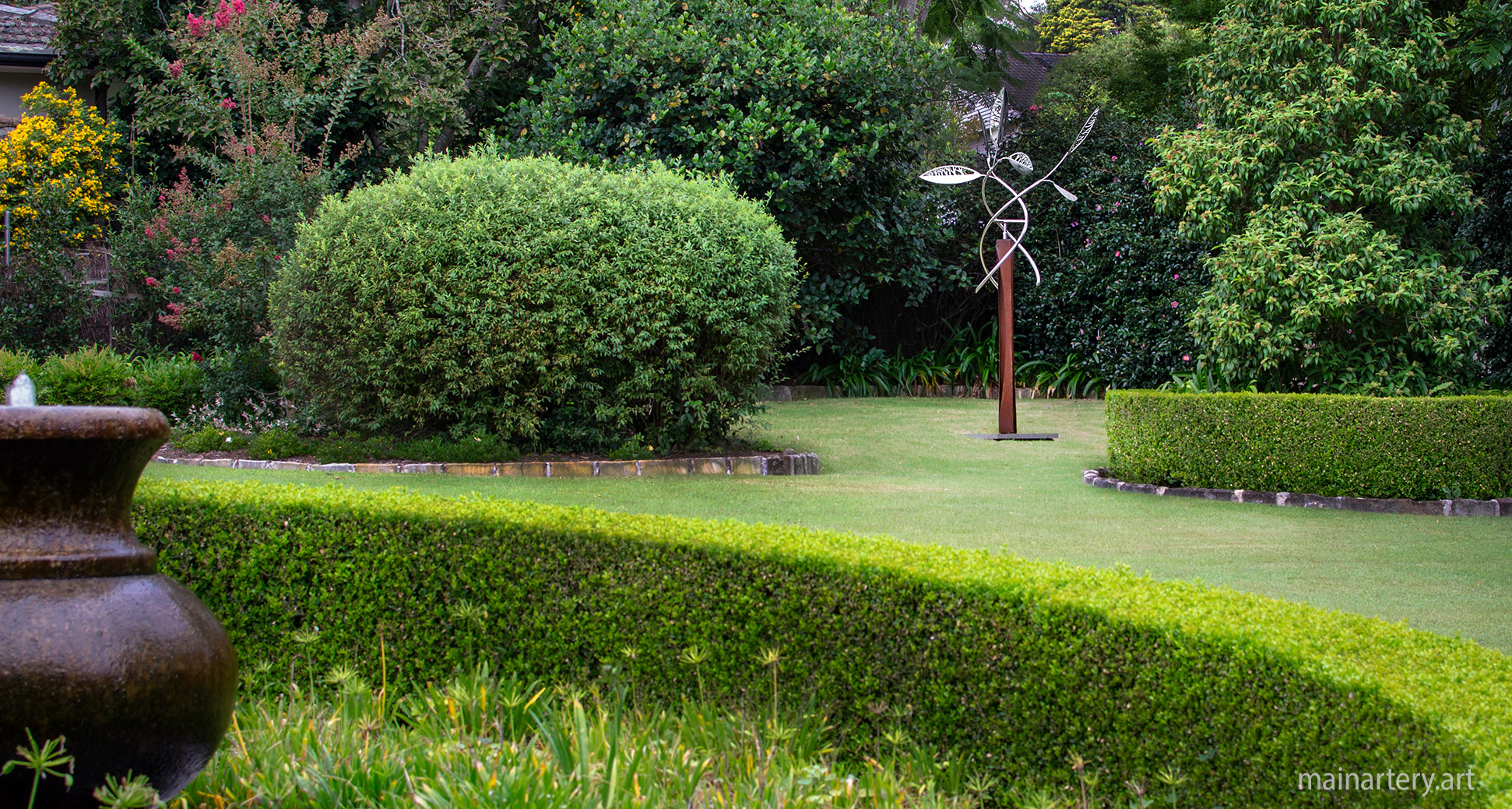 large stainless steel kinetic outdoor garden sculpture image