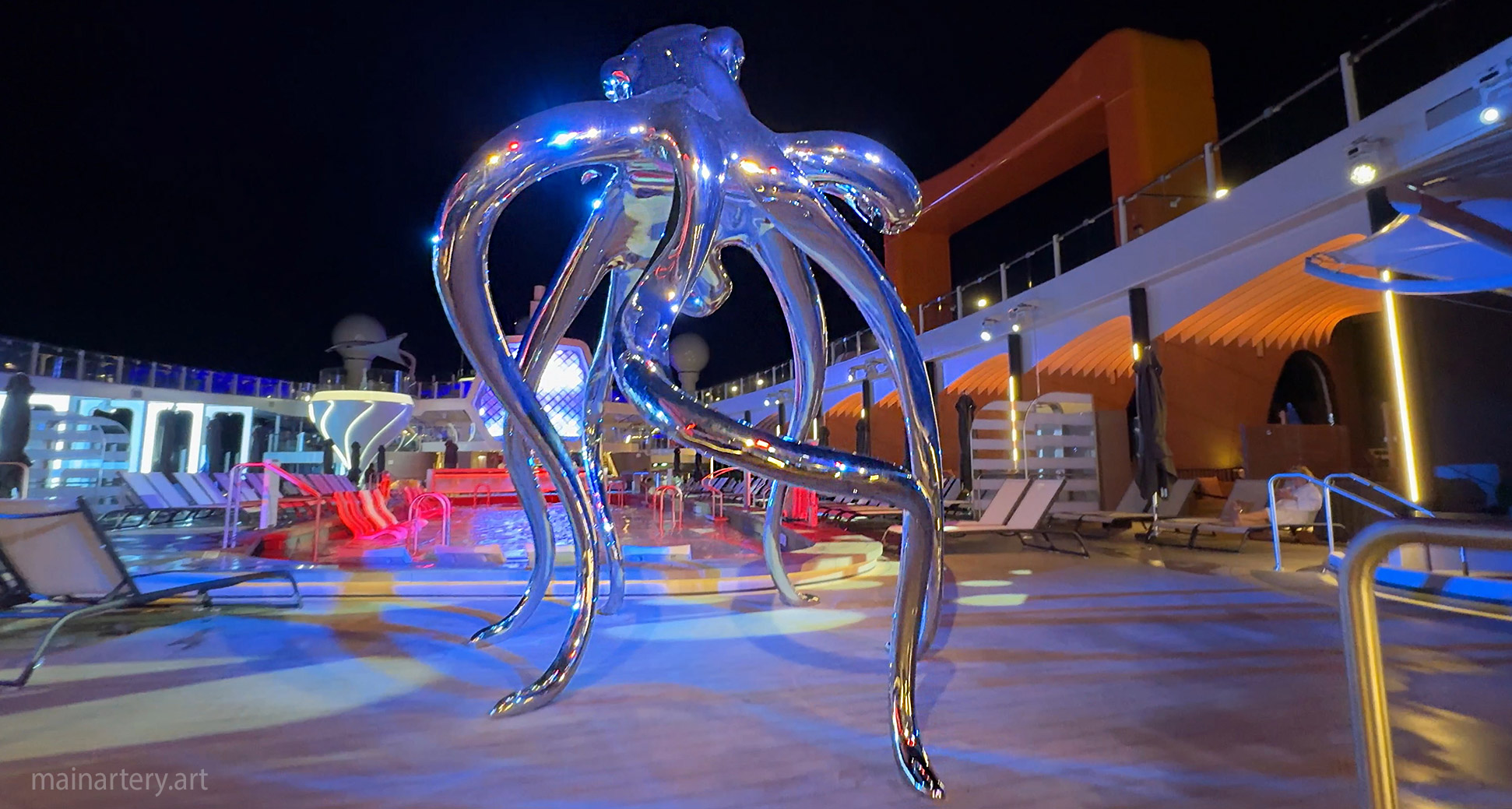 pool side celebrity ascent huge octopus sculpture image