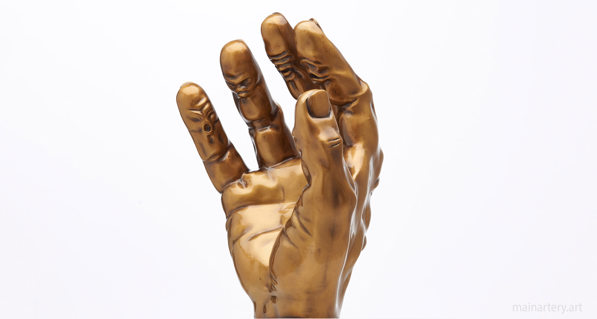 small bronze surreal hand artwork image