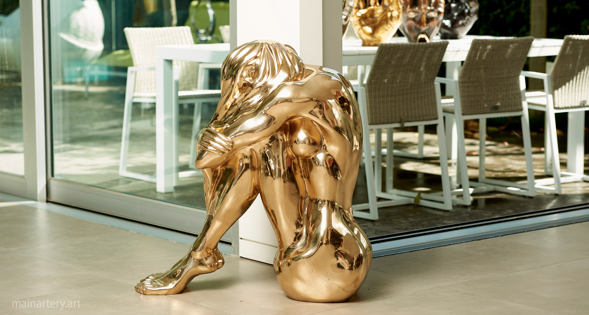 freestanding polished bronze interior art image