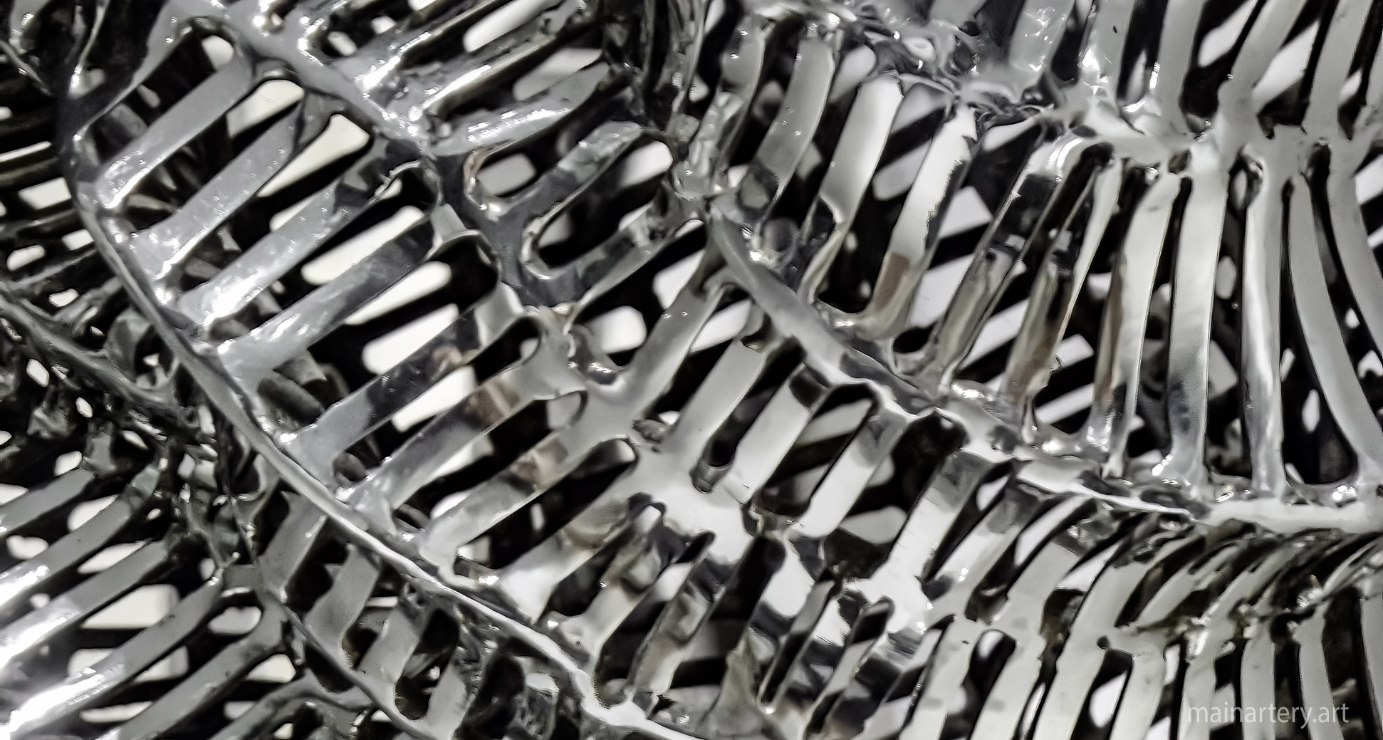 mainartery siesmic activity sculpture detail polished stainless image