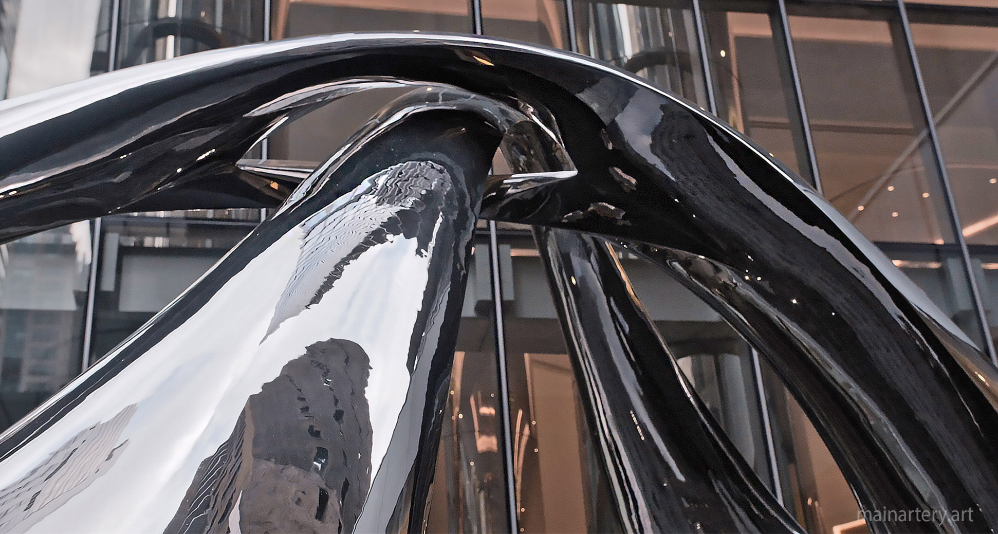 Monumental Stainless Organic Summit Public Artwork, blending organic forms with a modern aestheti