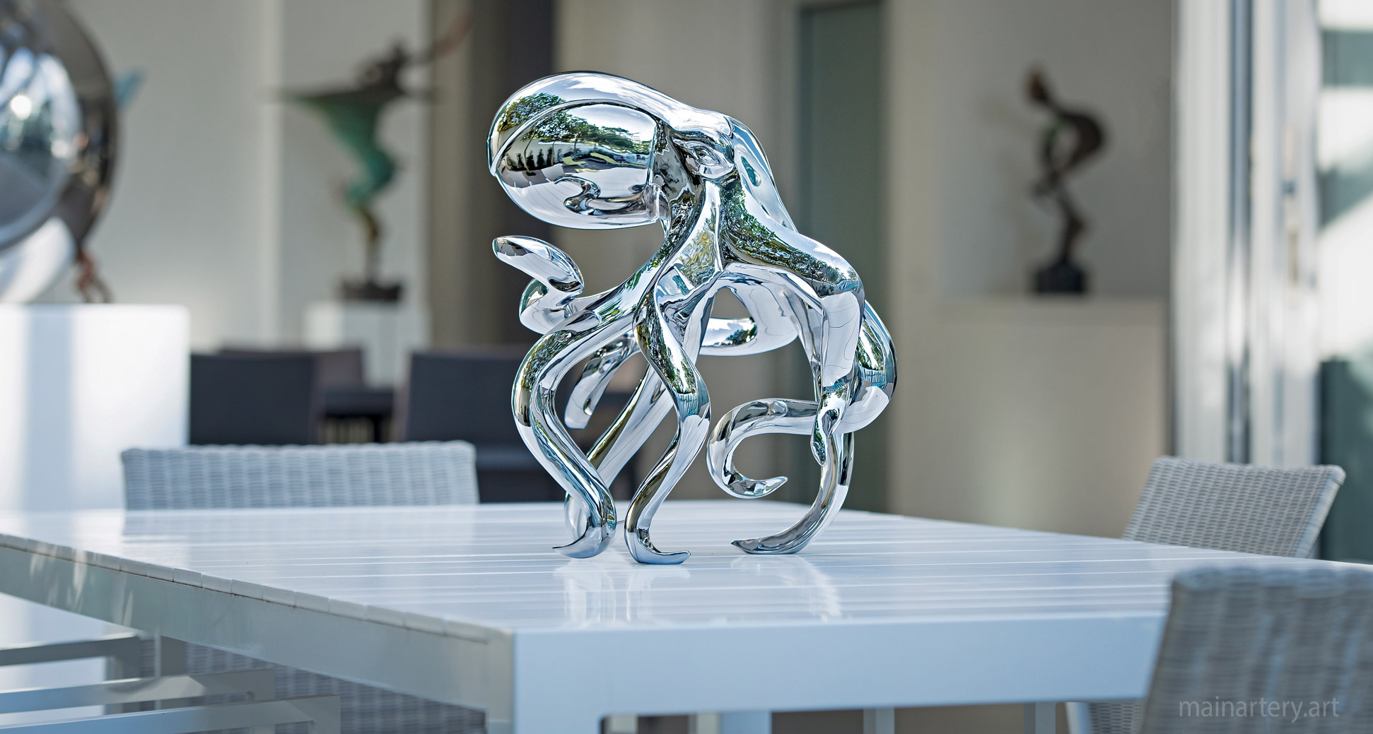 baby polished metal octopus garden art sculpture image