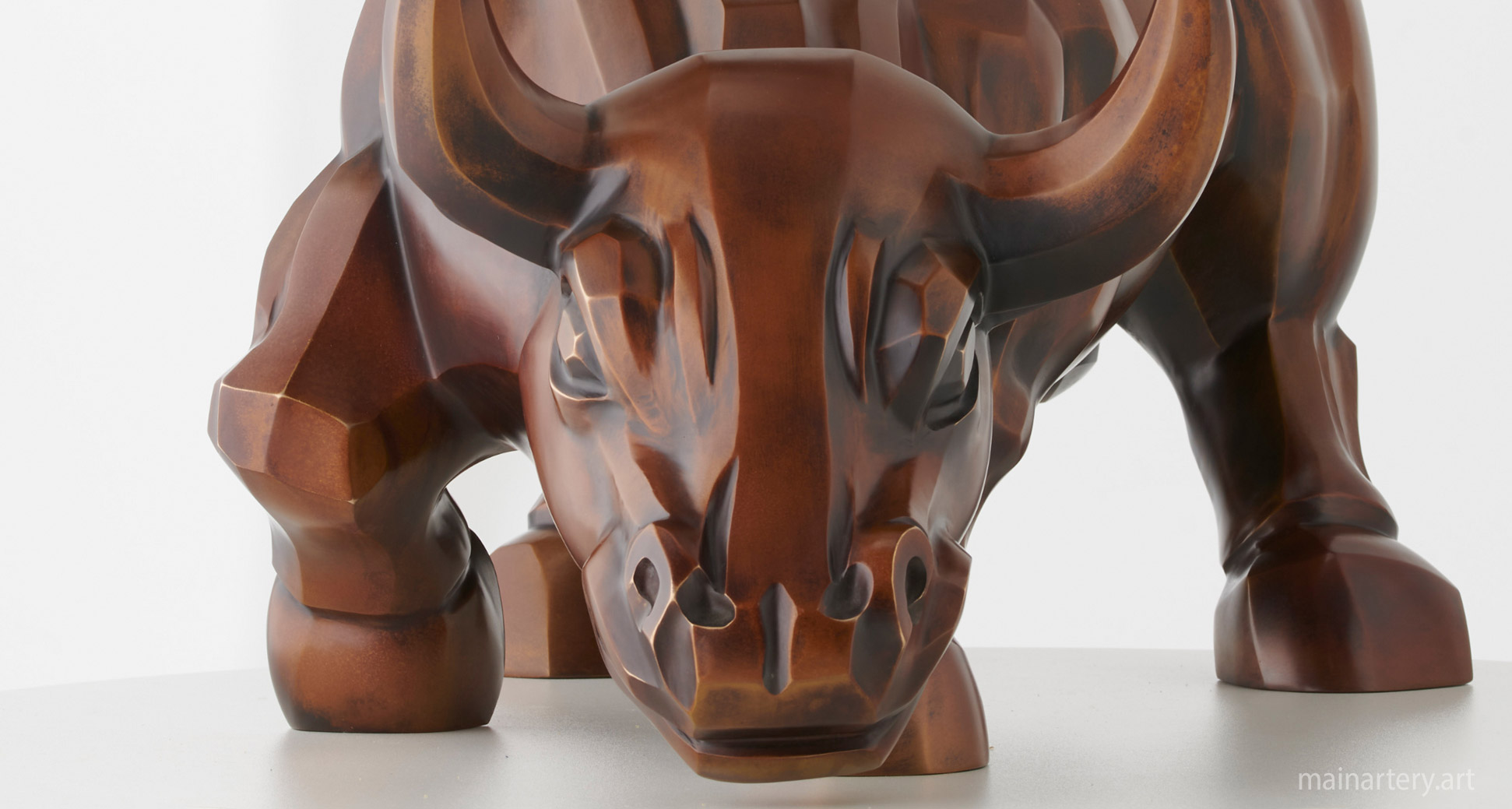 bronze raging bull charging interior sculpture image