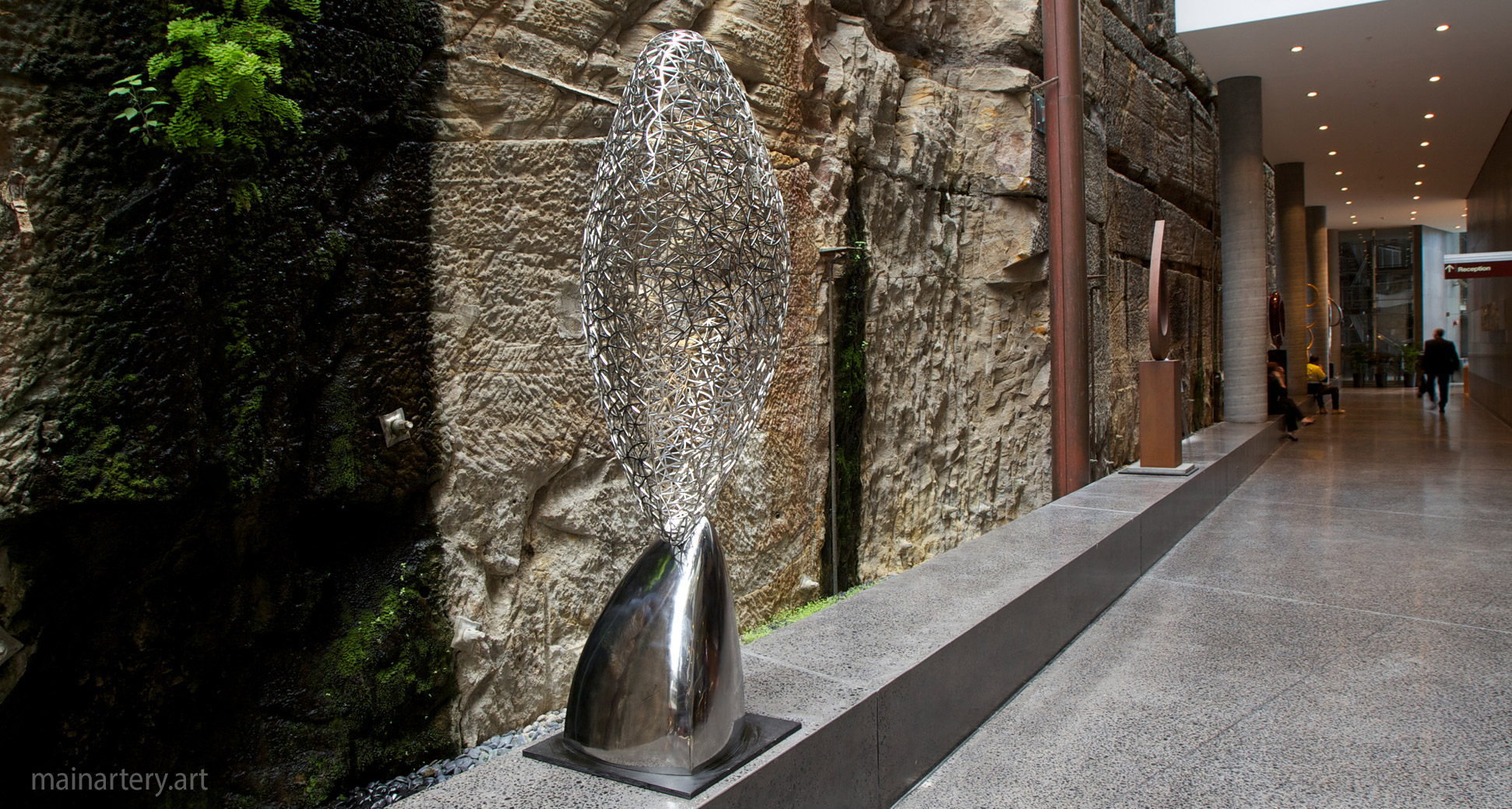 large stainless steel spherical interior artwork image