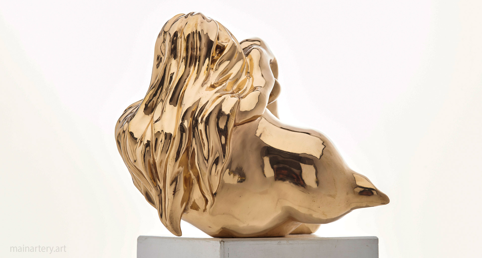 polished bronze female form shell sculpture image