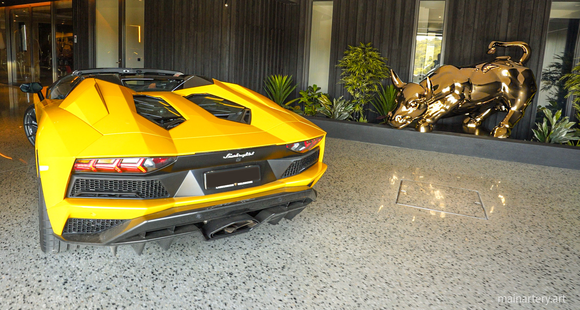 man cave entrance gold titanium charging bull lamborghini artwork image