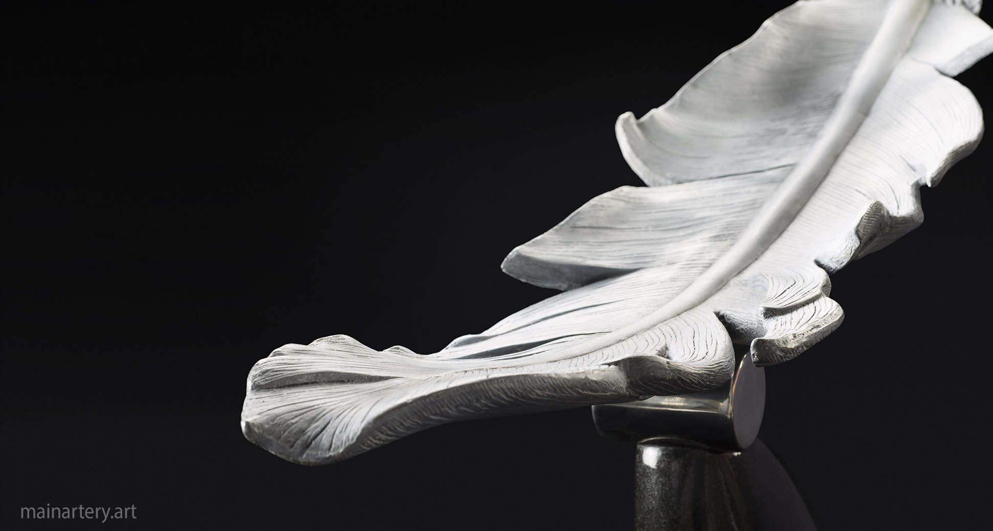 organic multi patina figurative feather sculpture image