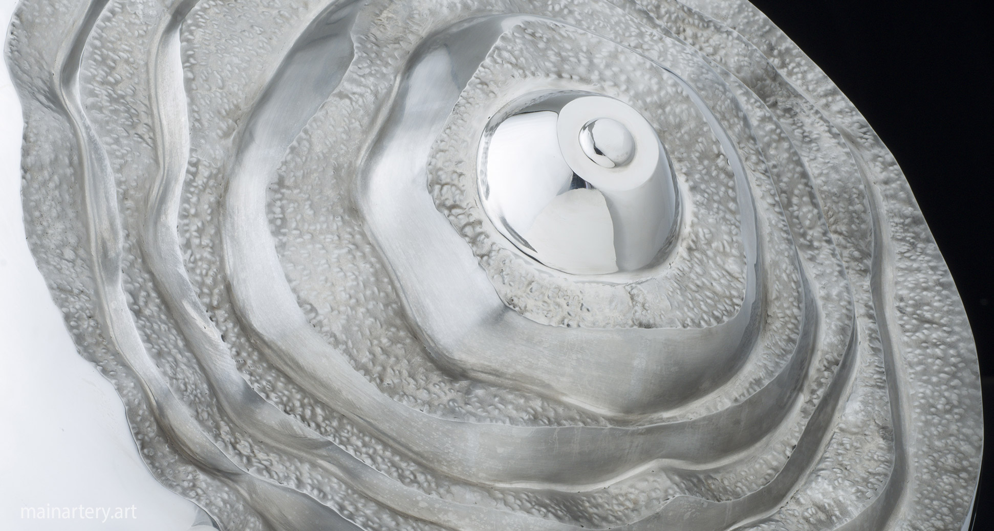 mirror polished spherical onion interior sculpture image